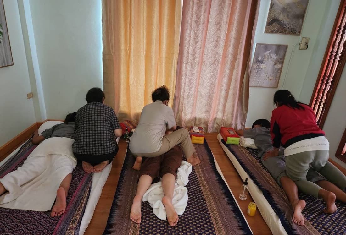 Therapists giving traditional Thai massage at Ranchuan, Khon Kaen